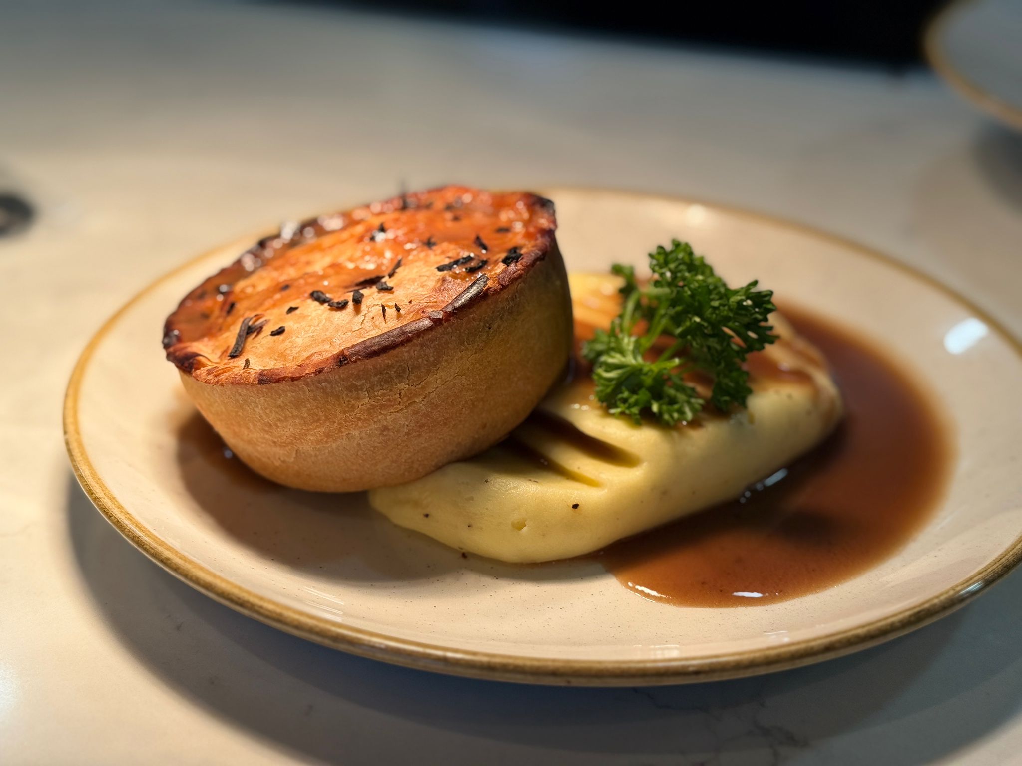 Pie of the day with creamy mash and onion gravy